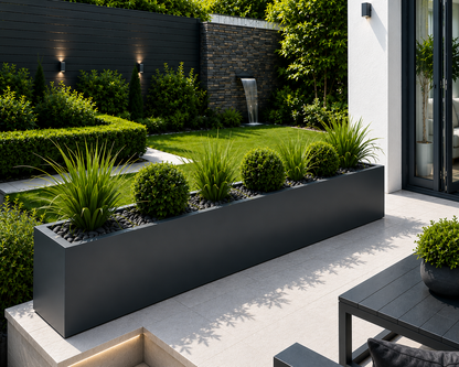 Modern garden with black planters and a water feature