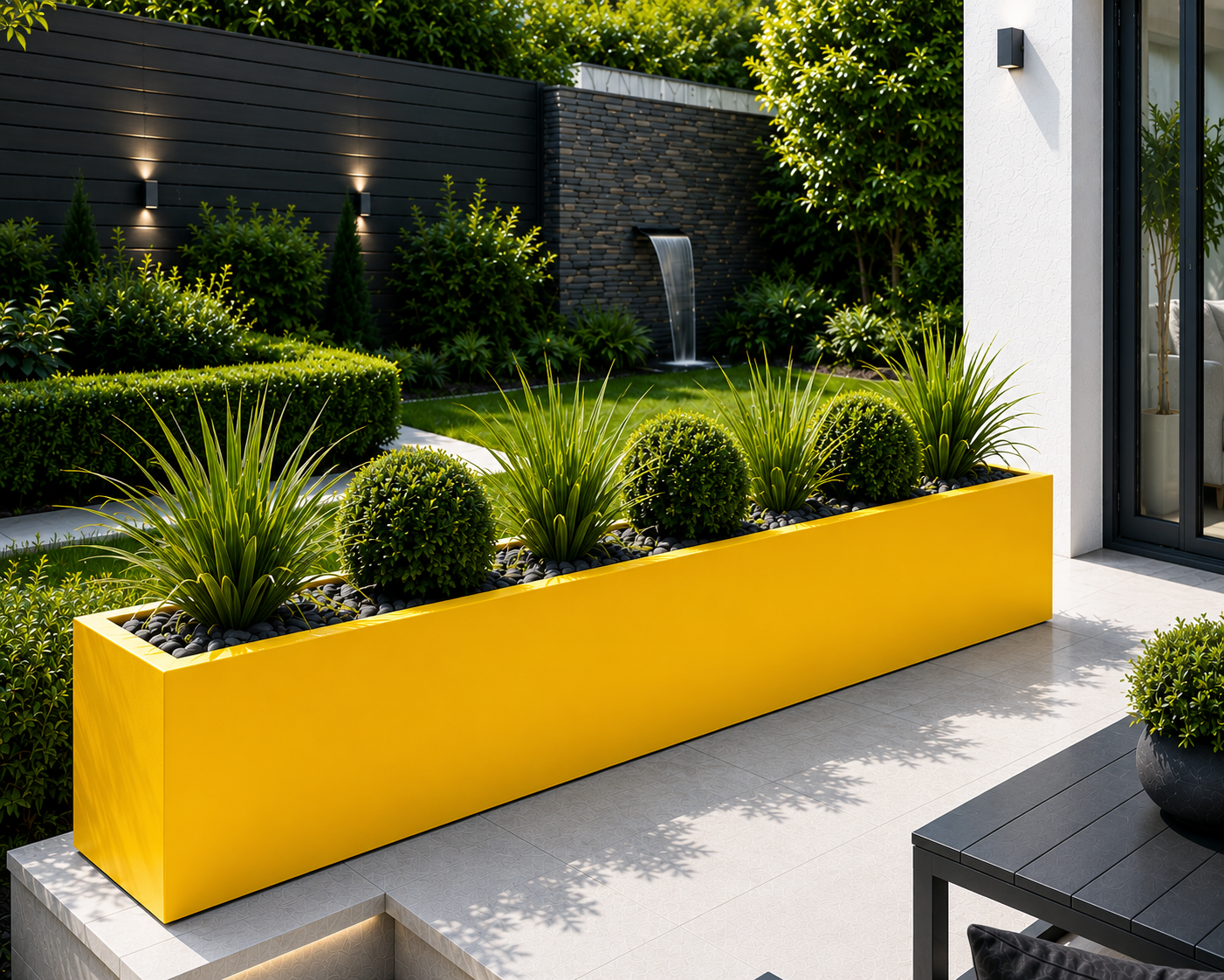 Yellow  garden planter with green plants in a modern garden setting